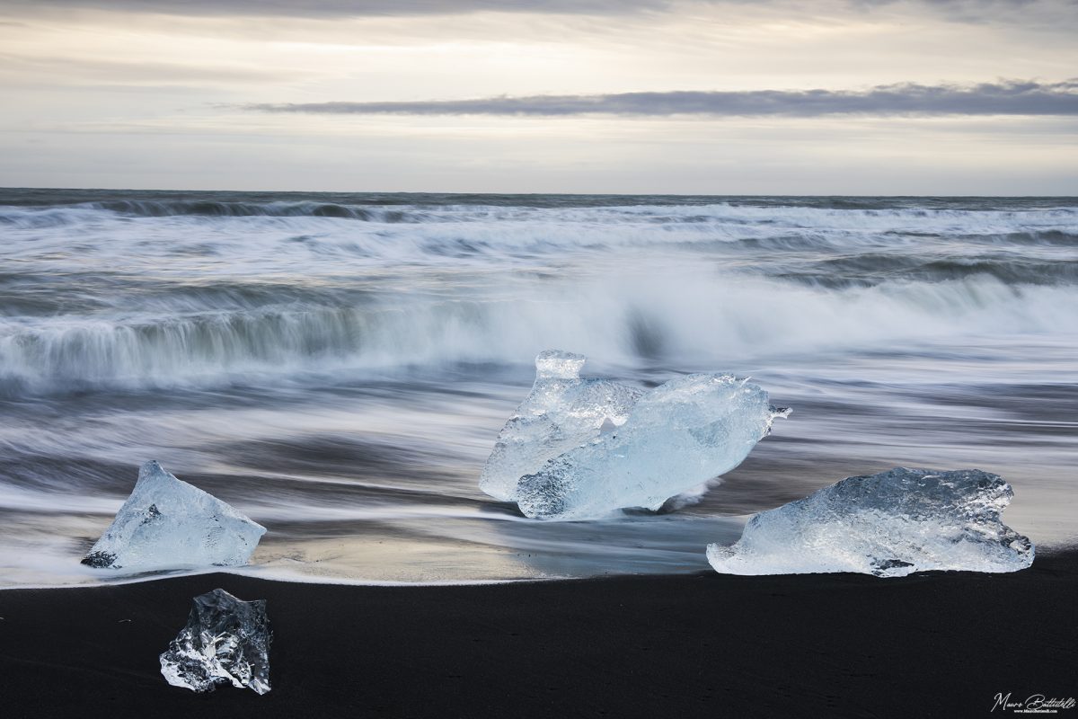 Ice blocks washed by the ocean waves.