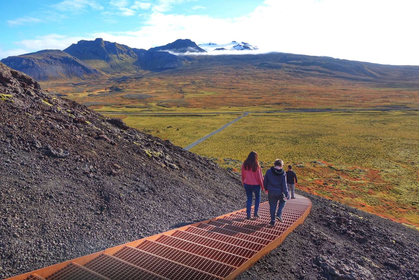 People hiking down the Saxhol crater.