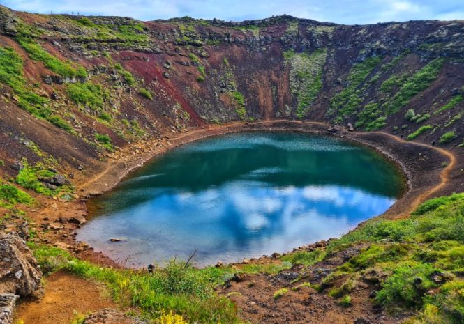 Kerid Volcano Crater Volcanic crater with mossy walls and a blue lake.