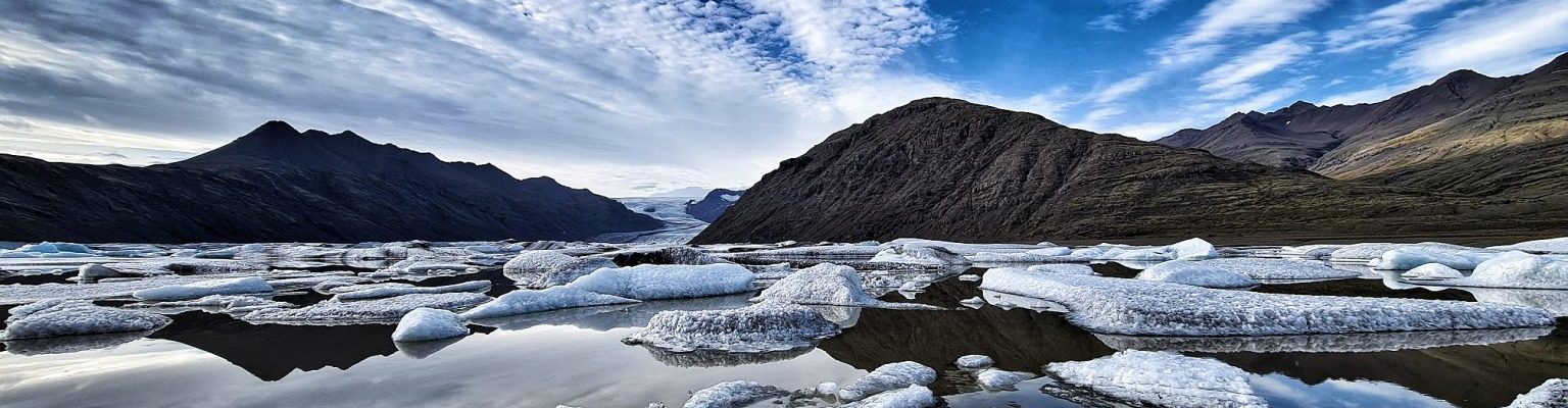 Glacier lagoon with view to the mountains.