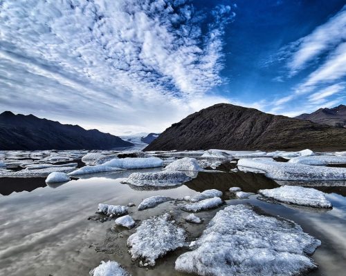 Glacier lagoon with view to the mountains.