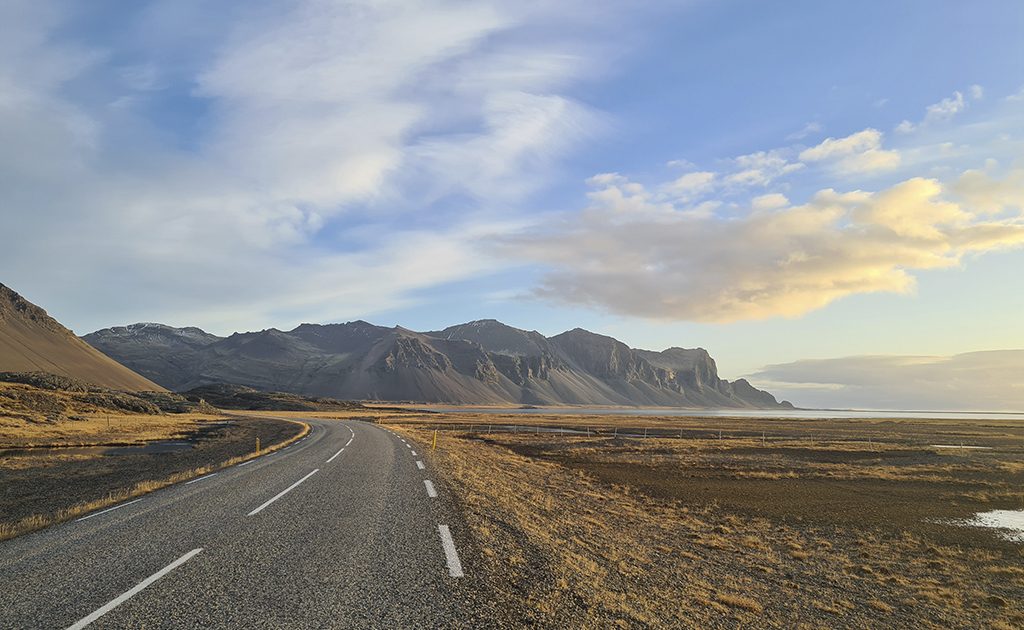 Main road in Iceland and mountains in the background.