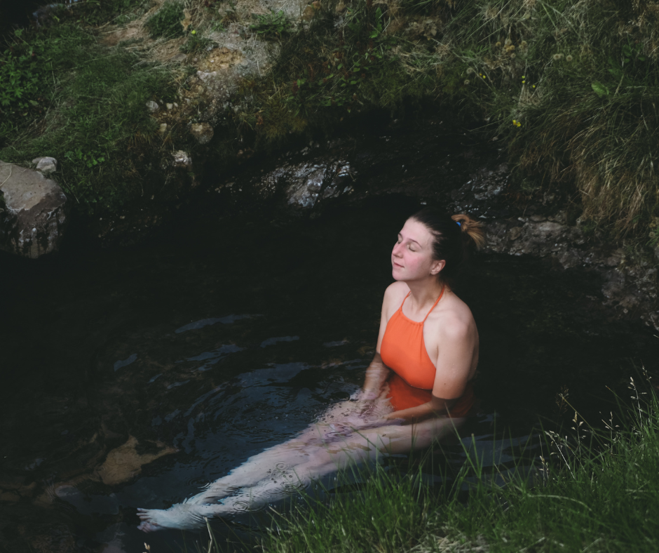 Lady relaxing in a natural hot spring.
