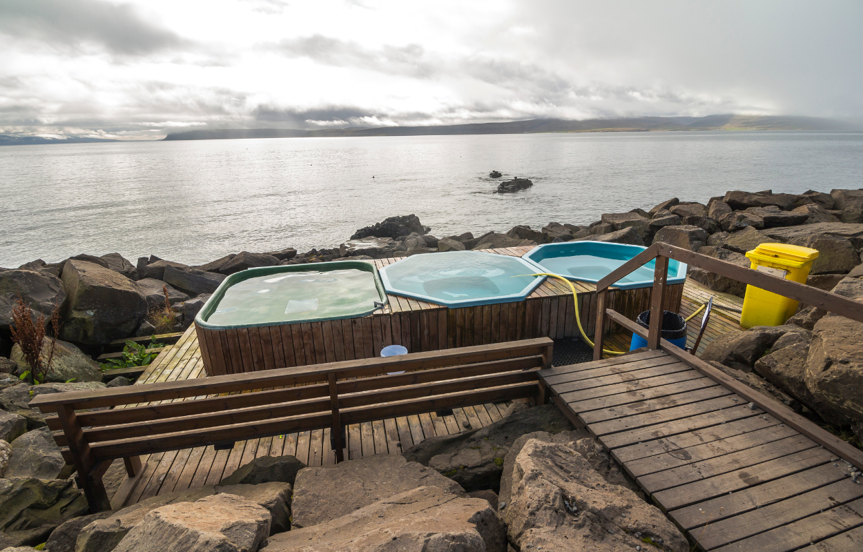 View of Drangsnes hot tubs and the fjords.